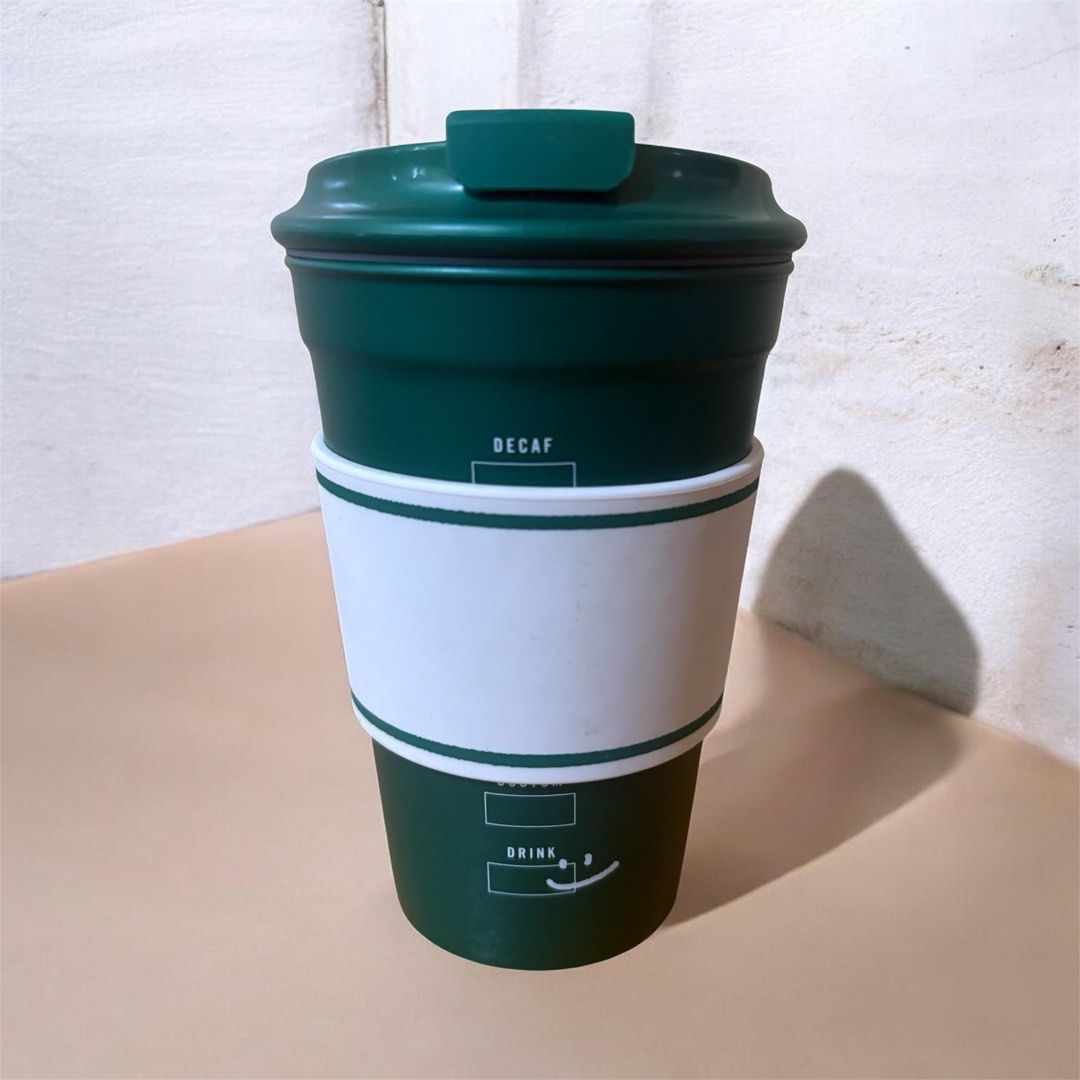Starbucks Green Coffee Cup 12oz (Category: Water Bottles & Tumblers) located in Manila. Submitted by justinstyleee (Listing ID 1442160854, Image 2). Description: - Green Starbucks coffee cup with sleeve - Perfect for travel and on-the-go - Capacity: 12 fl oz (355 ml) - Care: Hand wash only - Do not microwave .