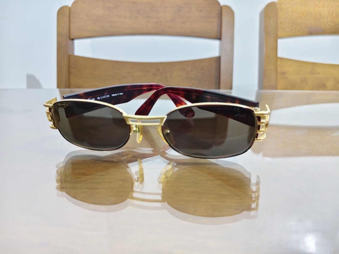 Sting Vintage Sunglasses Gold Red Tortoise Shell (Category: Sunglasses & Eyewear) located in Manila. Submitted by chynii_28 (Listing ID 1442175093, Image 2). Description: - Vintage ( STING ) sunglasses - Gold frame with red and tortoise shell arms - Dark lenses - Unique design with intricate detailing on the sides - A statement piece for any outfit -in good condition w/ hairline scratches on the frame - Great for sunny days.