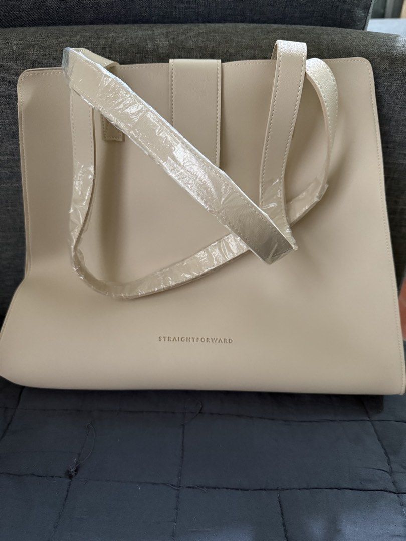 Straightforward Boundless Basics Tote Bag - DVL Kiyoto Sand (Category: Tote Bags) located in Quezon City. Submitted by junieveeee (Listing ID 1442167900, Image 3). Description: - Sand tote bag Boundless Basics from Straightforward - Simple and clean design - Magnetic snap closure - Internal pocket - Straps still wrapped in plastic (never used) - Ideal for everyday use or work.