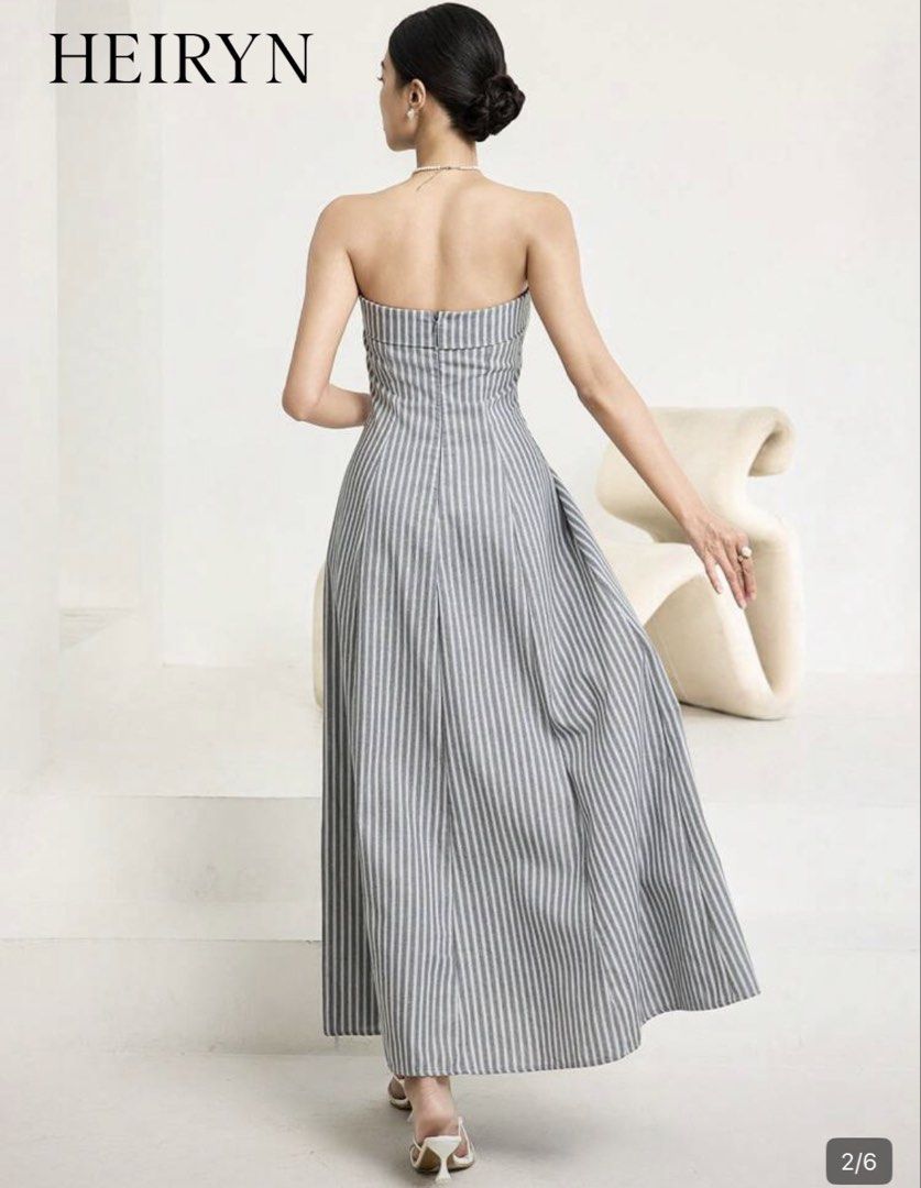 Striped Strapless Maxi Dress (Category: Dresses) located in Mandaluyong City. Submitted by dlsibal (Listing ID 1442192374, Image 2). Description: - HEIRYN strapless maxi dress - Grey and white vertical stripes - Fitted bodice with a flared A-line skirt - Perfect for summer events or nice dinners - Comfortable and chic Used a few times only - Versatile for dressing up or down.