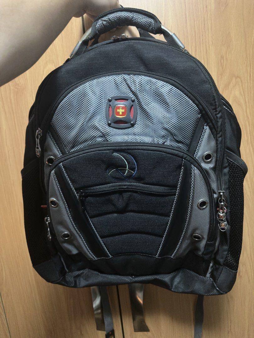 Swiss Gear Backpack Black Grey Laptop Bag (Category: Backpacks) located in Manila. Submitted by frzy009 (Listing ID 1442339722, Image 1). Description: Authentic SwissGear Heavy-Duty Laptop Backpack This is a special edition variant of their famous heavy-duty tech line (similar layout to the Ibex/1900 series), featuring a premium embroidered design on the front pocket. ✨ KEY FEATURES: Massive Capacity: Fits up to large 17-inch laptops in a dedicat