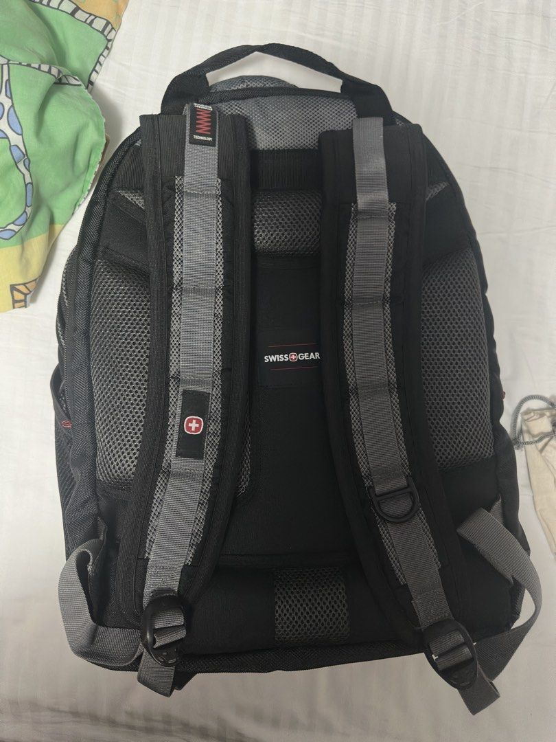Swiss Gear Backpack Black Grey Laptop Bag (Category: Backpacks) located in Manila. Submitted by frzy009 (Listing ID 1442339722, Image 2). Description: Authentic SwissGear Heavy-Duty Laptop Backpack This is a special edition variant of their famous heavy-duty tech line (similar layout to the Ibex/1900 series), featuring a premium embroidered design on the front pocket. ✨ KEY FEATURES: Massive Capacity: Fits up to large 17-inch laptops in a dedicat