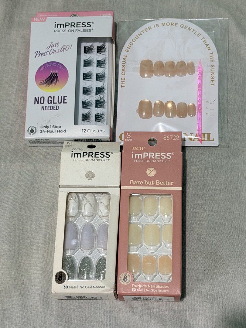 TAKE ALL - KISS imPRESS Press-on Nail Sets & Falsies - Nails and Lashes (Category: Hands & Nails) located in Quezon City. Submitted by velleshop (Listing ID 1442156677, Image 1). Description: - Bundle includes 12 no-glue press-on falsie clusters. - Two sets of imPRESS press-on manicures included: - Marble and glitter design - Nude shade: 'Bare but Better' - All sets are no-glue needed for easy application. - Enjoy a 24-hour hold for both nails an