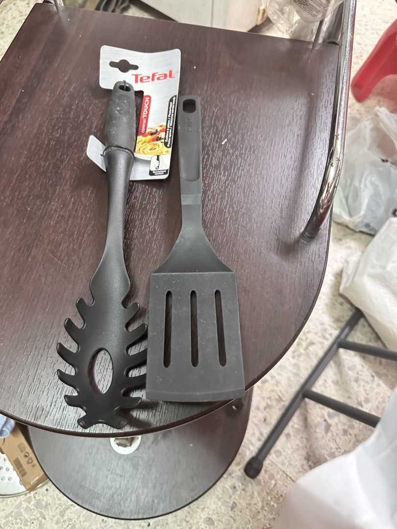 Tefal Spaghetti Server and Spatula Set (Category: Other Kitchenware & Tableware) located in Quezon City. Submitted by mystictiger.019d9c (Listing ID 1442314418, Image 1). Description: - Set includes: 1 Tefal Spaghetti Server & 1 Black Slotted Spatula - Material: Durable Plastic - Tefal Spaghetti Server: Unique design for easy serving - Black Slotted Spatula: Ideal for flipping and draining food - Great additions to any kitchen!.