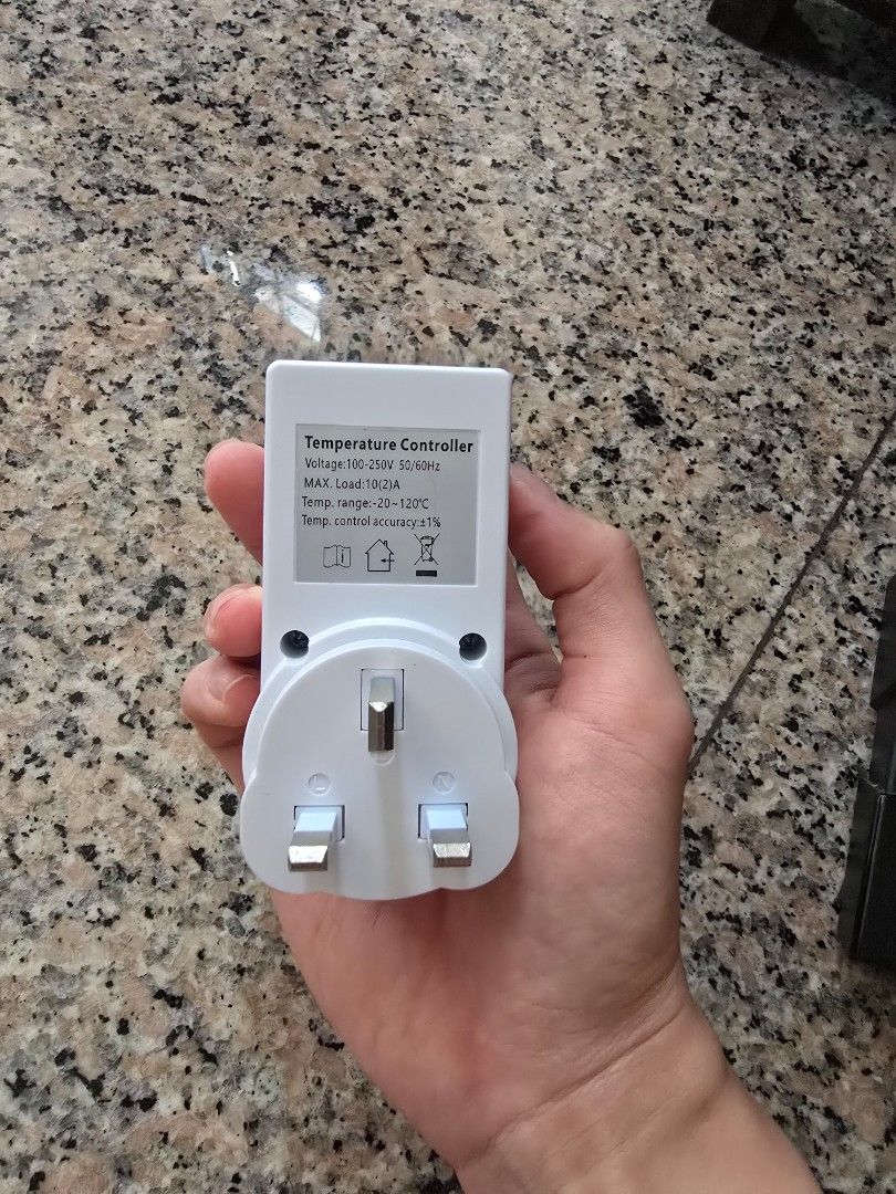Temperature Controller Plug (Category: Electrical, Adaptors & Sockets) located in Singapore. Submitted by -sssss- (Listing ID 1442194568, Image 2). Description: Digital temperature controller with a UK plug. Set your desired temperature and it will maintain it. Great for incubators, terrariums, or heating/cooling setups. Easy to use with start and stop buttons. Shows current temperature on the display. Max load 10A/2200W. Temp range 0-120°C..
