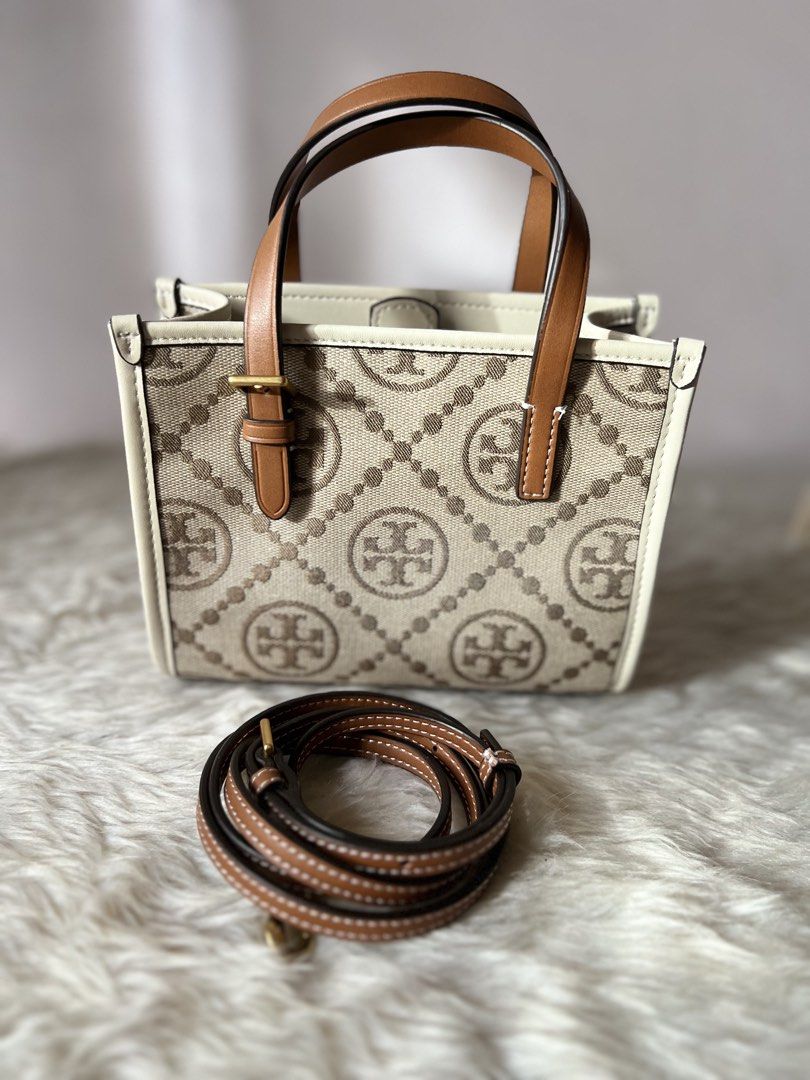 Tory Burch Monogram Mini Tote (Category: Luxury Bags & Wallets) located in Makati City. Submitted by b.estillo (Listing ID 1442257417, Image 2). Description: Original Tory Burch Mini tote, can fit iphone promax Source: Korea With generic dustbag only Coded.