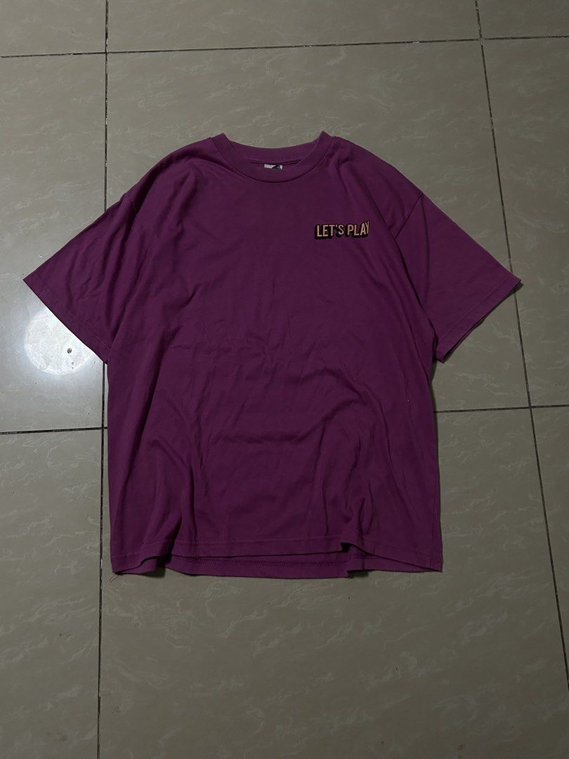 Vintage graphic purple shirt (Category: Tshirts & Polo Shirts ) located in Santa Rosa. Submitted by mandeclutterzzz (Listing ID 1442262549, Image 2). Description: Dimes: Width:20 inches Length:27 inches - Eye-catching purple t-shirt - Fun graphic on the back: a record character dancing with musical notes - Text on back: "LET'S PLAY SOMETHING NICE" - Small "LET'S PLAY" detail on the front chest - Classic short sleeves and crew neck design - Ideal 