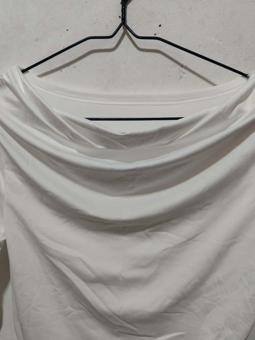 White Long Sleeve Drape Neck Top - L (Category: Blouses) located in Taguig. Submitted by phoopa (Listing ID 1442218724, Image 3). Description: - Elegant white long sleeve top - Features a stylish draped neckline - Made from soft, stretchy material for comfort - Slightly curved hemline - Subtle ruching detail on the side - Brand new with tag attached - Versatile piece: dress it up or down!.
