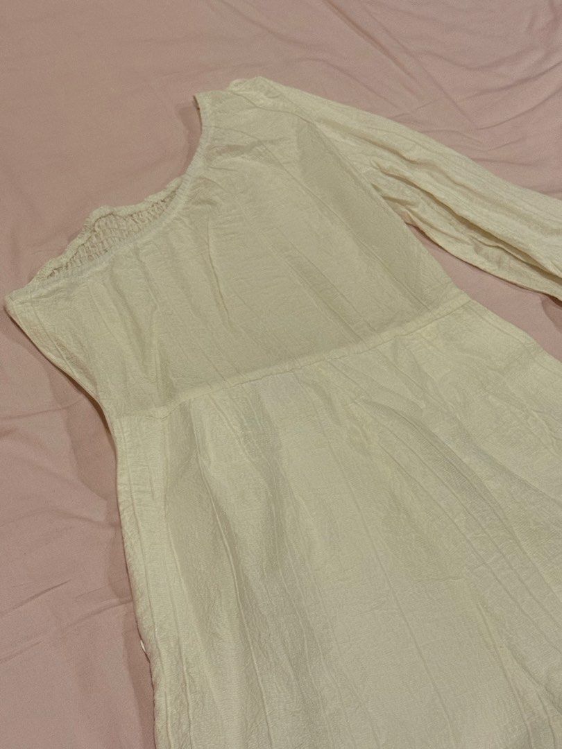 White One-Shoulder Smocked Romper with Puff Sleeve (Category: Rompers) located in Quezon City. Submitted by ellereve_ph (Listing ID 1442319774, Image 2). Description: - White one-shoulder romper - Smocked bodice for a comfortable fit - Features a stylish single puff sleeve - Textured fabric adds a unique touch - Convenient side zipper closure - Ideal for casual wear or beach trips.