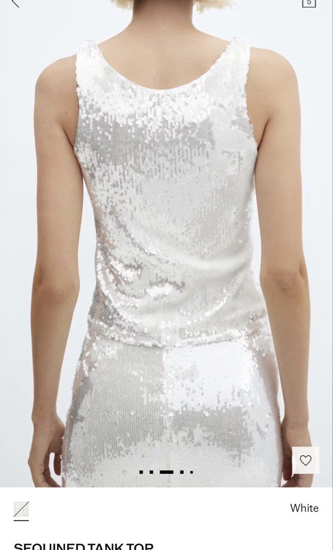 White Sequined Tank Top (Category: Sleeveless) located in Mandaluyong City. Submitted by dlsibal (Listing ID 1442192612, Image 3). Description: - Sparkly white tank top - All-over sequin embellishments - Sleeveless design - Ideal for parties and dressing up outfits - Looks stunning under lights - Versatile: pair with jeans or a skirt - Very eye-catching piece.