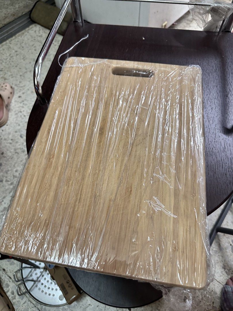 Wooden Cutting Board with Handle (Category: Knives & Chopping Boards) located in Quezon City. Submitted by mystictiger.019d9c (Listing ID 1442316748, Image 1). Description: - Sturdy wooden cutting board - Features a convenient handle for easy carrying - Perfect for chopping vegetables and meat - Comes wrapped in plastic for hygiene.