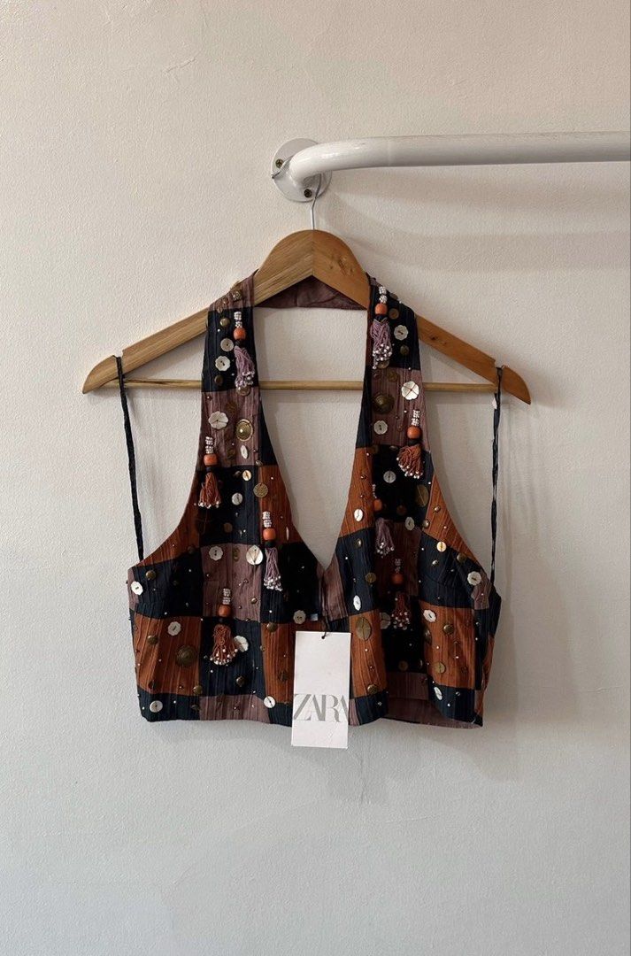 Zara Embellished Halter Neck Crop Top (Category: Sleeveless) located in Agdangan. Submitted by preloved_patch (Listing ID 1442156934, Image 1). Description: - Zara halter neck crop top - Features a checkered pattern - Embellished with beads, sequins, and tassels - Ties at the neck and back - Unique design, used once for a night out - size xs on tag but fits xs-semi med Rfs: decluttering .