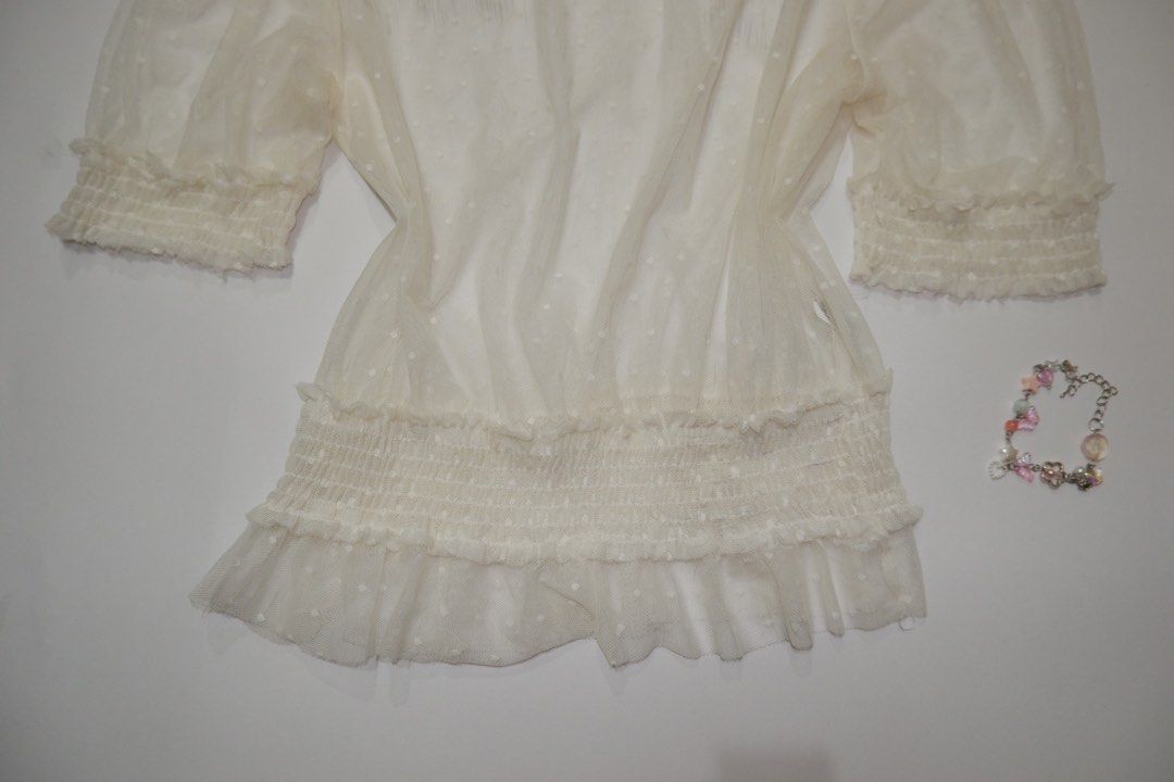 Zara Sheer Polka dots Puff Sleeve Top (Category: Blouses) located in Pasig City. Submitted by mjca29 (Listing ID 1442233775, Image 3). Description: White sheer top from Zara - Puff sleeves with elasticated cuffs - Smocked waist with ruffled hem - Ideal for layering over a bralette or camisole Size: Small to Medium *2nd Pic w/Circle -Just dirt, need to wash. No issue *Manage your expectation. Pre-loved item *Color may vary due to lighting SF will 