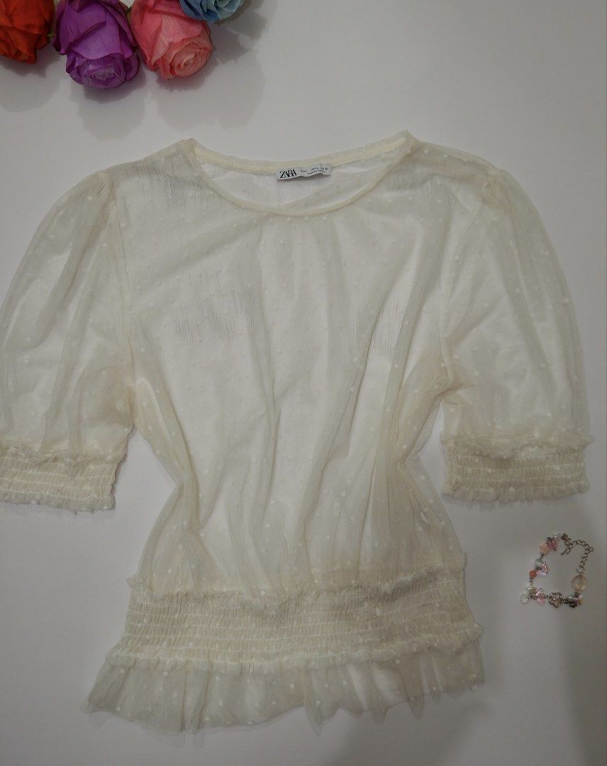 Zara Sheer Polka dots Puff Sleeve Top (Category: Blouses) located in Pasig City. Submitted by mjca29 (Listing ID 1442233775, Image 1). Description: White sheer top from Zara - Puff sleeves with elasticated cuffs - Smocked waist with ruffled hem - Ideal for layering over a bralette or camisole Size: Small to Medium *2nd Pic w/Circle -Just dirt, need to wash. No issue *Manage your expectation. Pre-loved item *Color may vary due to lighting SF will 