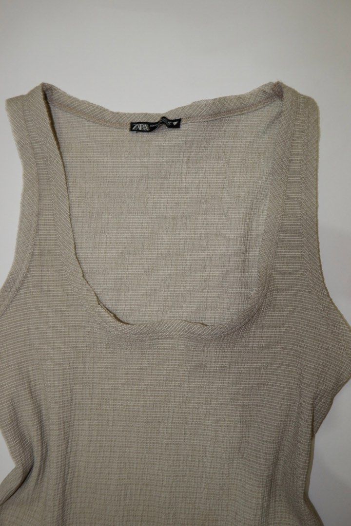 ZARA Textured Tank Top (Category: Sleeveless) located in Pasig City. Submitted by mjca29 (Listing ID 1442235506, Image 2). Description: - ZARA textured tank top - Lettuce hem detail - Scoop neckline Size: Semi-Medium *Manage your expectation. Pre-loved item *Color may vary due to lighting SF will shouldered by buyer.