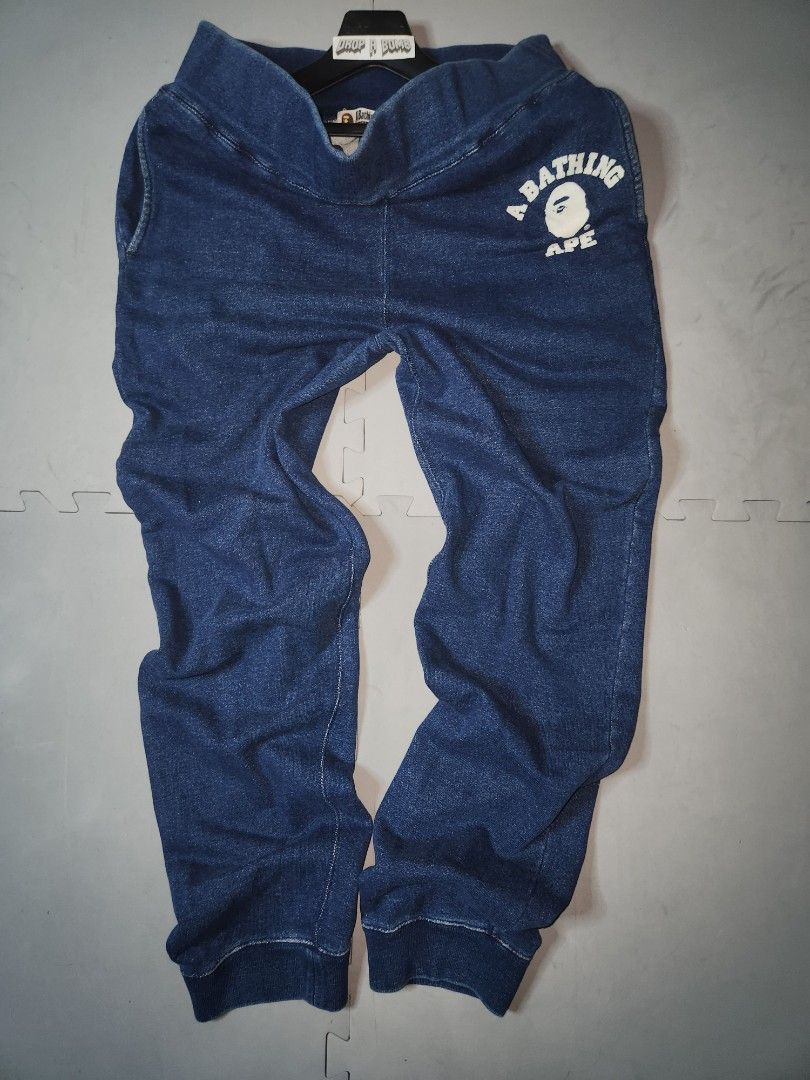 A Bathing Ape BAPE Denim Sweatpants Size L (Category: Joggers) located in Baguio. Submitted by dab.garms (Listing ID 1442459885, Image 1). Description: Selling a pair of BAPE denim sweatpants. Features the classic BAPE logo on the thigh. Elastic waistband and cuffs. Size L. Great for casual wear. Check out the photos for details. BAPE SWEATPANTS Item Details: Large on Tag Measurements ( inches ): Waistline(Width): 34 - 36 Waist to Leg Opening(Len
