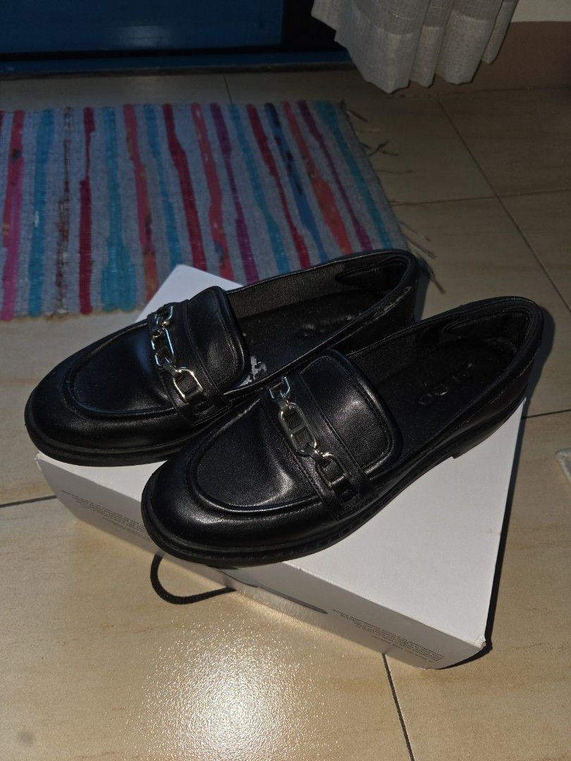 ALDO Black Chain Detail Loafers (Category: Loafers) located in Makati City. Submitted by shoppreloved_ (Listing ID 1442371492, Image 2). Description: BARELY used cos it's too big on me. but outer synthetic leather is starting to come off due to time in storage. No damage in the sole area / inside the shoes - the gray thing you see in the sole is leftover sticker paper from orig packaging shipping to be arranged by buyer. pls pick up in Makati. - 