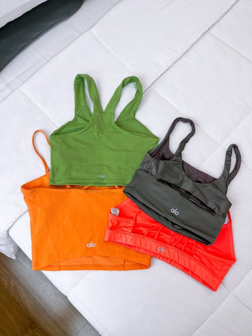 Alo Yoga Sports Bras Bundle (Green, Orange, Red, Grey) (Category: Activewear) located in Muntinlupa City. Submitted by jasmin.shop (Listing ID 1442361982, Image 1). Description: - Bundle of 4 Alo Yoga sports bras - Includes: green racerback, orange strappy crop top, bright red, and dark grey styles - Versatile: Great for workouts or as a layering piece - Authentic: All feature the Alo logo (SEE INDIVIDUAL POST).
