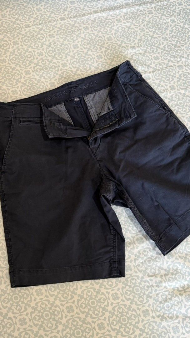 American Eagle Navy Blue Chino Shorts (Category: Shorts) located in Manila. Submitted by d0304 (Listing ID 1442478956, Image 3). Description: - Navy blue American Eagle chino shorts - US Men 30 - Classic fit, ideal for casual wear - Two back pockets - Comfortable and durable material - Versatile for everyday outfits.