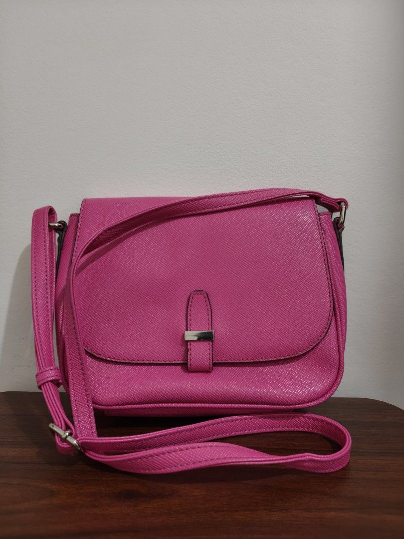 Anne Klein Pink Crossbody Bag (Category: Cross-body Bags) located in Manila. Submitted by bmsthrift (Listing ID 1442451884, Image 2). Description: - Cute pink crossbody bag by Anne Klein - Convenient zip pocket on the back - Adjustable strap for a comfortable fit - Ideal size for carrying your essentials - Perfect for everyday use.