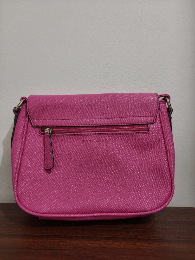 Anne Klein Pink Crossbody Bag (Category: Cross-body Bags) located in Manila. Submitted by bmsthrift (Listing ID 1442451884, Image 3). Description: - Cute pink crossbody bag by Anne Klein - Convenient zip pocket on the back - Adjustable strap for a comfortable fit - Ideal size for carrying your essentials - Perfect for everyday use.