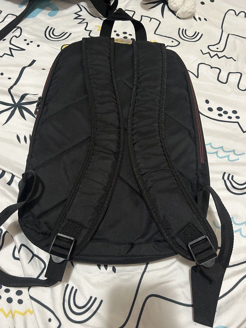 ASUS Black Laptop Backpack (Category: Backpacks) located in Paranaque City. Submitted by allthatclutterph (Listing ID 1442505553, Image 2). Description: - Stylish black ASUS backpack - Features a front zip pocket with eye-catching red trim - Adjustable straps for a comfortable fit - Multiple internal compartments for organized storage - Durable zippers with distinct ASUS branding - Ideal for carrying your laptop and daily essentials - Seldom used