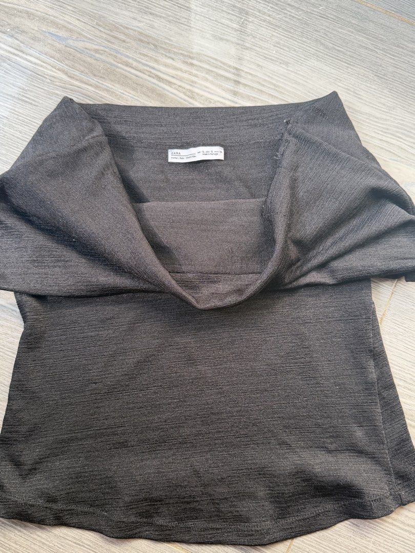 Authentic Zara Black Off Shoulder Textured Top (Category: Blouses) located in Iligan City. Submitted by jytomps (Listing ID 1442411855, Image 2). Description: - Zara black off-shoulder top - Textured fabric for a unique look - Stretchy material for ultimate comfort - Estimated size S - Perfect for casual or dressed-up outfits -old zara.