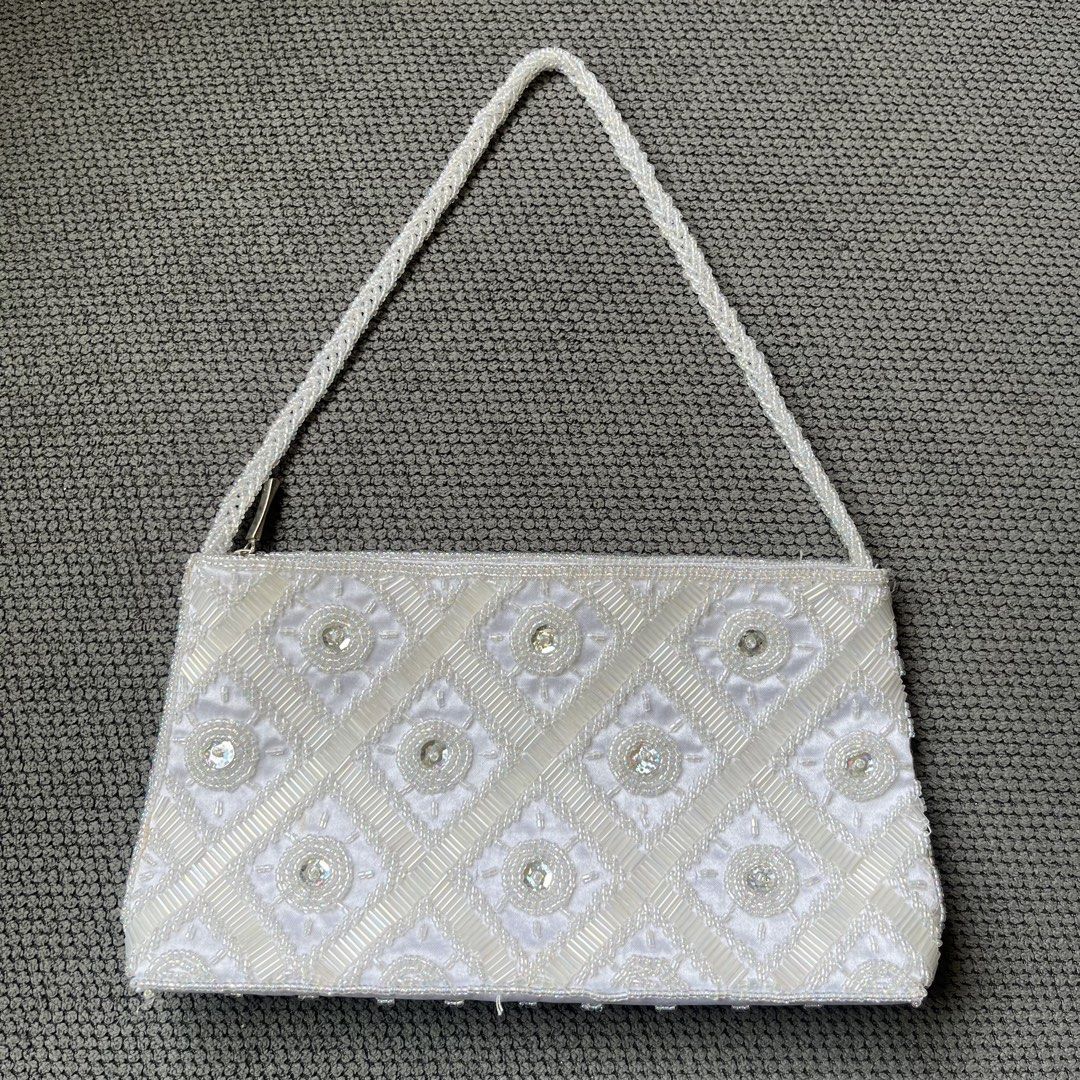 Beaded White Japan Party Shoulder Bag (Category: Shoulder Bags) located in Silang. Submitted by f4iry4rch1ve (Listing ID 1442440698, Image 1). Description: Beaded White Japan Party Shoulder Bag 650 php+ sf Condition: 9.5/10, tiny orange stain sa bottom Dimensions: view the pictures above -from Japan -1 compartment - actual photos Note: Colors may vary due to lighting Please message me for shipping and payment method... .