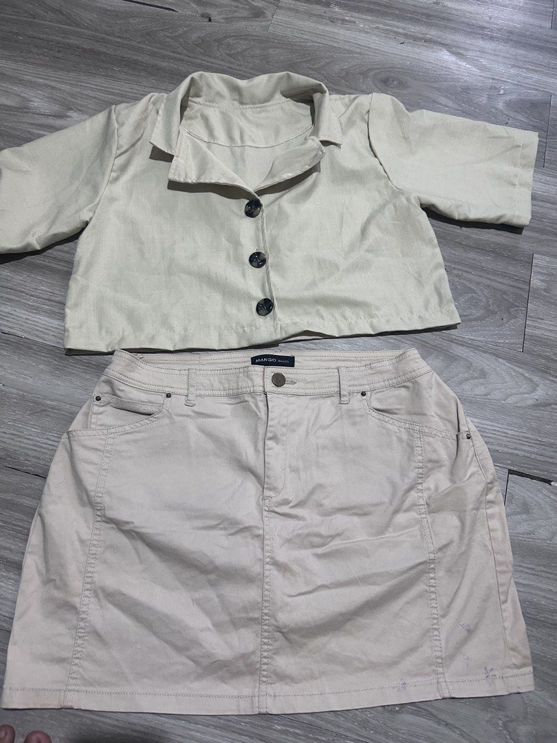Beige Cropped Jacket and Skirt Set (Category: Sets or Coordinates) located in Manila. Submitted by fayeepcl_ (Listing ID 1442485333, Image 2). Description: - Beige cropped and matching mini skirt set - Jacket features a collar and three buttons - Skirt is mini length with functional pockets - Please note: light purple marks on the skirt, as shown in the last photo - Ideal for creating a chic casual outfit.