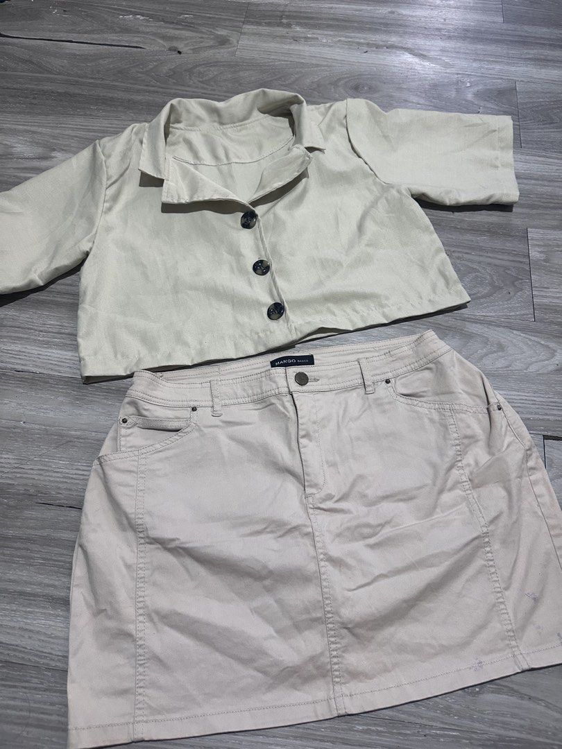 Beige Cropped Jacket and Skirt Set (Category: Sets or Coordinates) located in Manila. Submitted by fayeepcl_ (Listing ID 1442485333, Image 1). Description: - Beige cropped and matching mini skirt set - Jacket features a collar and three buttons - Skirt is mini length with functional pockets - Please note: light purple marks on the skirt, as shown in the last photo - Ideal for creating a chic casual outfit.