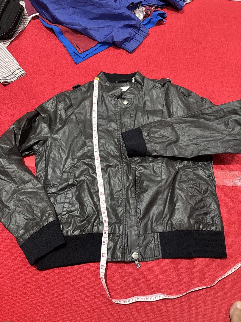 Ben Sherman Heritage Bomber Jacket (Category: Coats, Jackets and Outerwear) located in Manila. Submitted by pormaatbpshoppe (Listing ID 1442381500, Image 3). Description: - Ben Sherman Heritage bomber jacket - Color: Dark grey - Material: Shiny fabric - Closure: Zip-up front with snap button overlay - Features: Ribbed cuffs, hem, and collar lining - Style: Great for layering - Condition: Please check photos for details.