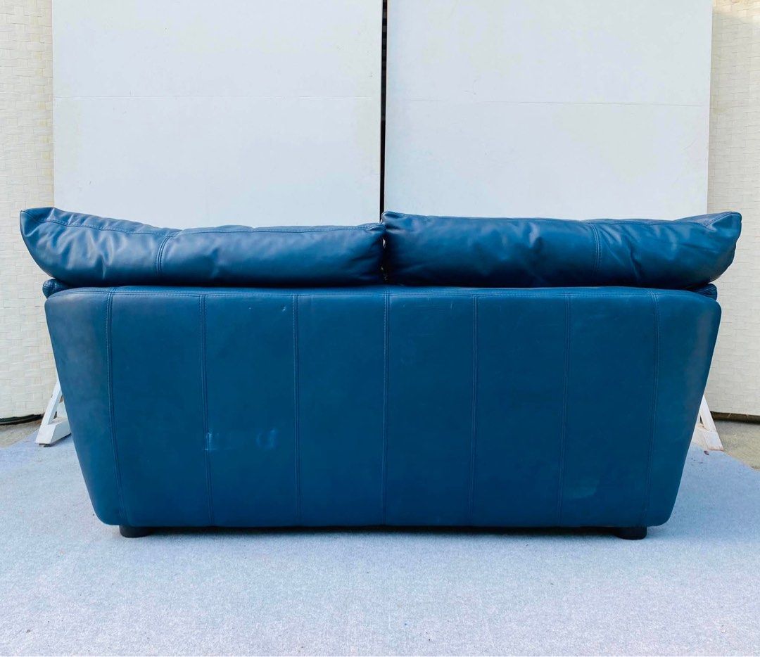 Blue Leather 2-Seater Sofa (Category: Sofas) located in Manila. Submitted by fastowl-0781 (Listing ID 1442517487, Image 1). Description: - Comfortable blue 2-seater leather sofa - Perfect for smaller spaces - Soft leather and plush cushions for ultimate lounging - Ready for its new home!.