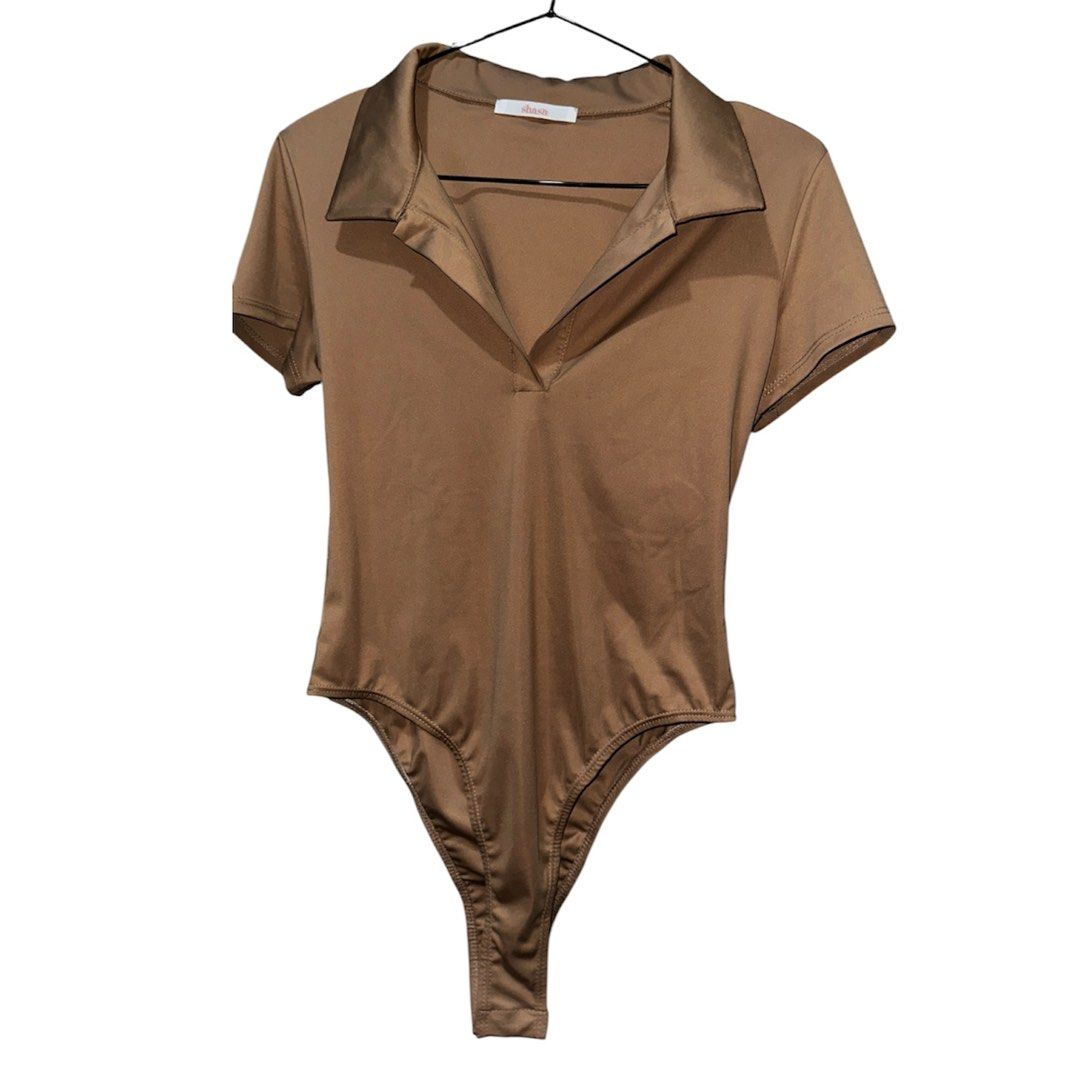 Bodysuits (Category: Blouses) located in Manila. Submitted by myessentials101 (Listing ID 1442472832, Image 3). Description: - Bundle of 3 Shein bodysuits - Colors: Emerald Green, Black, Tan/Nude - Style: Short sleeves, collared neckline with V-cut - Versatile: Great for layering or wearing on their own - Comfortable and stylish Buy these shirts in New zealand, on our off shore leave. I don't know the brand i'll just put shein. Just selling this 