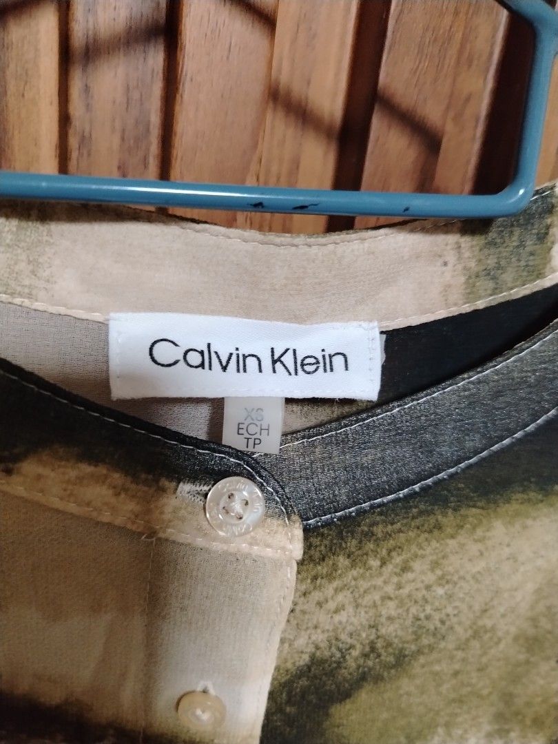 Calvin klein woman blouse sheer button- down top (Category: Blouses) located in Cavite. Submitted by oncetop_declutter (Listing ID 1442391735, Image 2). Description: never used no hangtag SF c/ o buyer no washtag but orig..