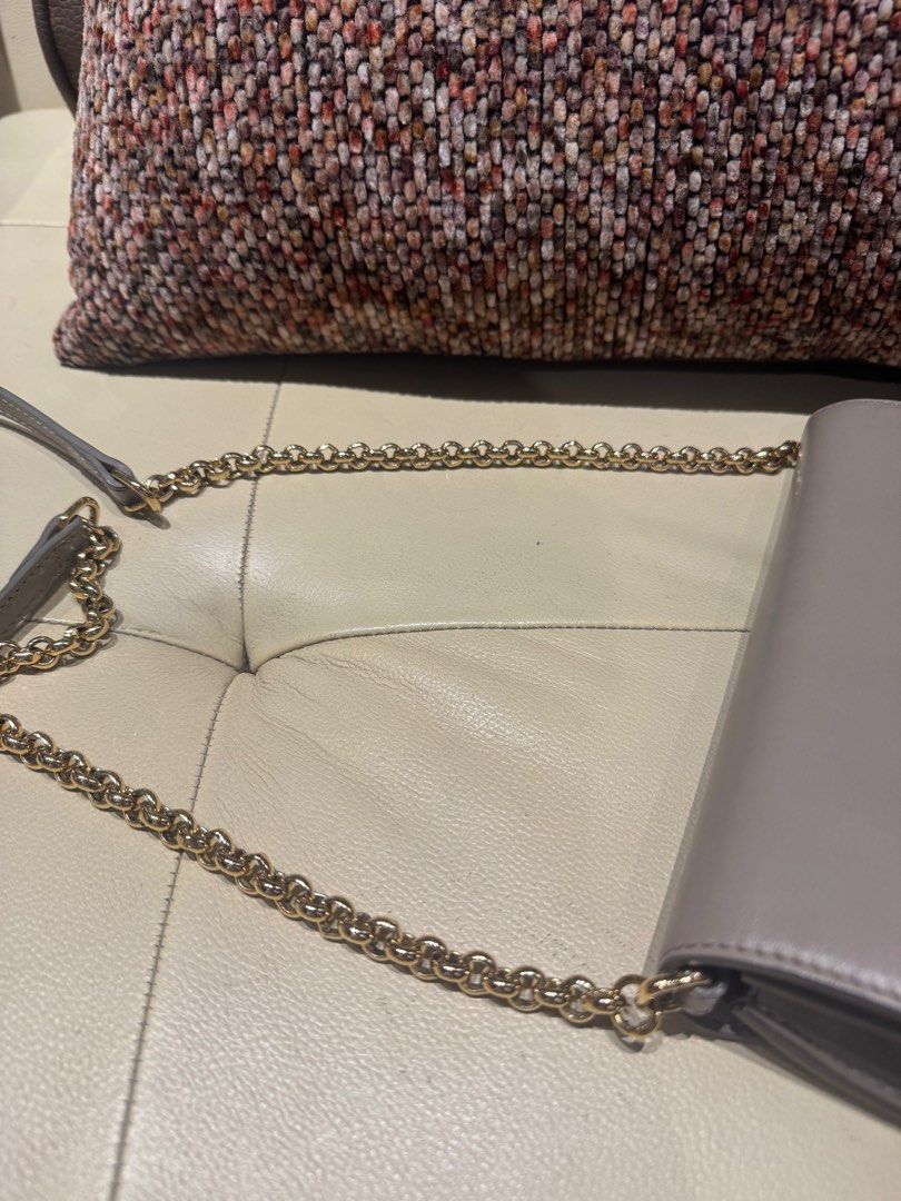 Chloe C Bag Beige Leather with Suede Chain Strap (Category: Luxury Bags & Wallets) located in Quezon City. Submitted by annsapp (Listing ID 1442446522, Image 2). Description: - Grey leather and suede Chloe C bag - Gold hardware with signature C logo - Detachable chain strap - Interior features card slots and a zip pocket - Clean inside and out - Ideal for evenings or traveling light.