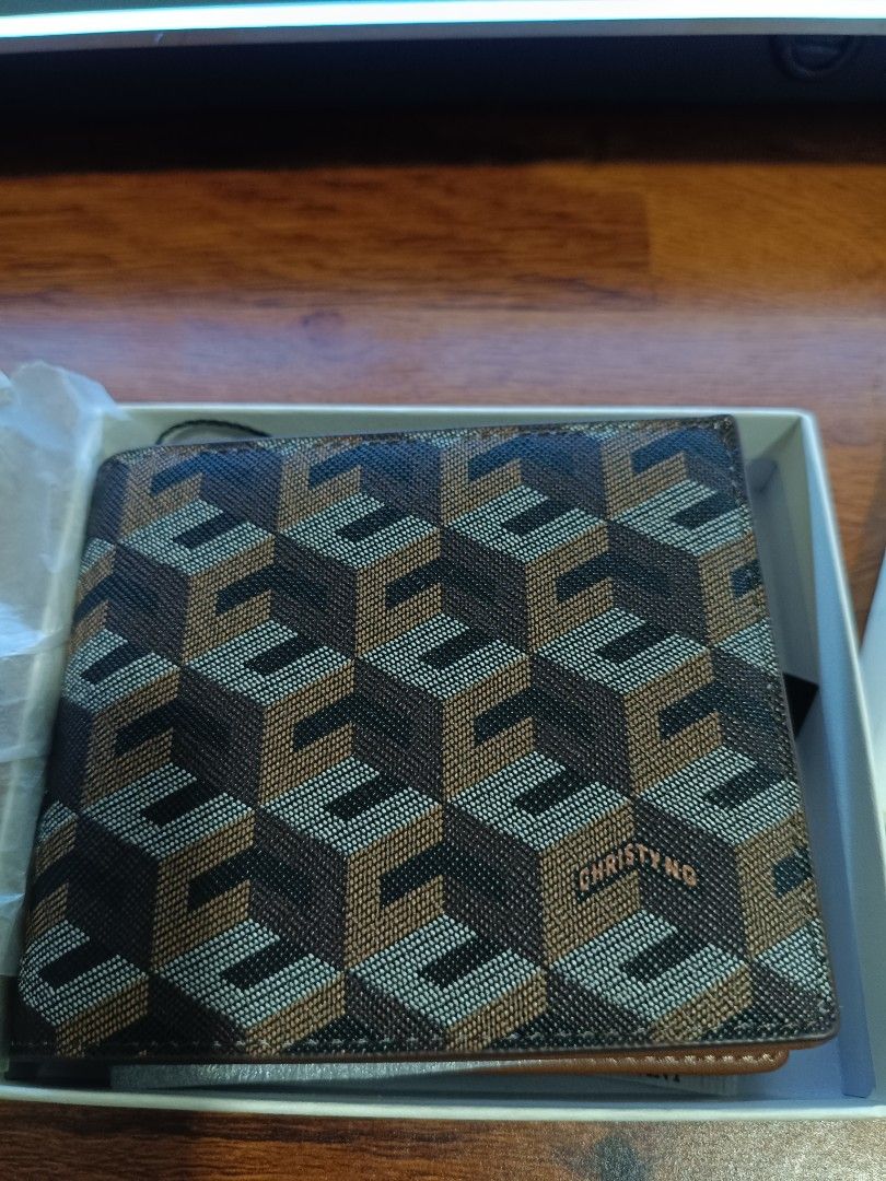 Christy Ng Mateo Wallet Walnut Brown (Category: Wallets & Card holders) located in Manila. Submitted by getthiztodymoonfhph (Listing ID 1442526220, Image 3). Description: Christy Ng Mateo wallet in Walnut Brown. Features the brand's signature geometric pattern. Interior is a classic brown leather. Comes with original box and tags. Bought recently, never used..