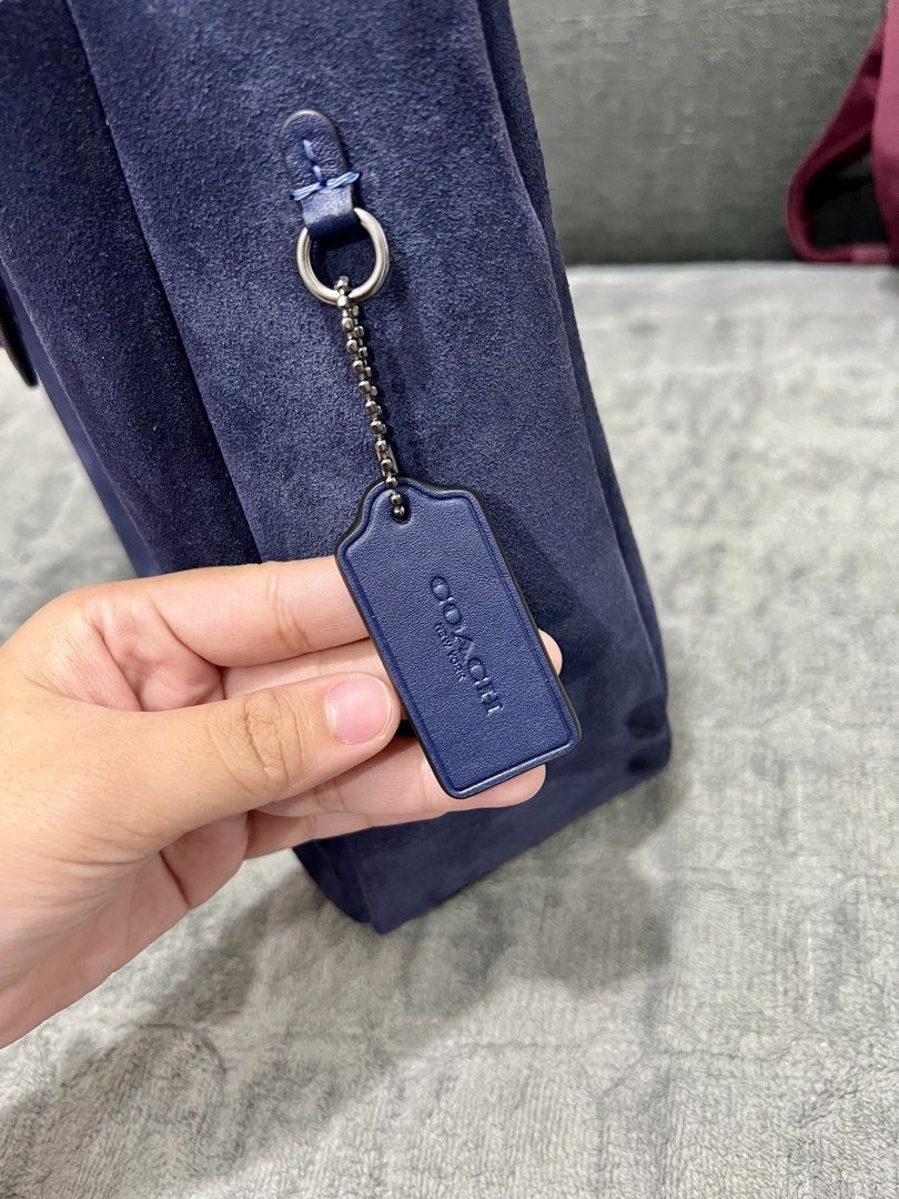 Coach Hadley Convertible in True Navy Suede (Category: Luxury Bags & Wallets) located in Las Pinas. Submitted by djcarla14 (Listing ID 1442468550, Image 3). Description: Flaws: • Signs of wear, which are normal for suede material bags • Lipstick stain • Marks on the turn lock hardware Features: • Convertible straps (can be worn as crossbody) • US bought Inclusions: • Complete with care card Usage: • Used thrice only DM FOR MORE PICS.
