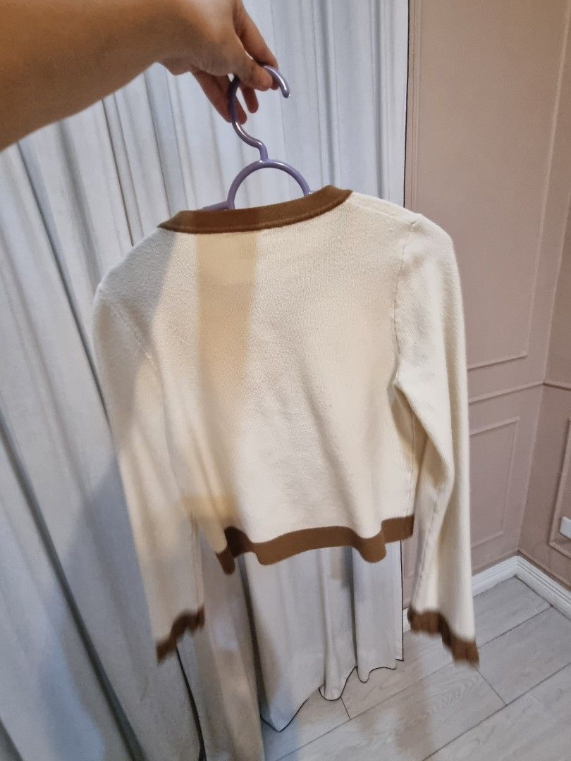 Cream & Brown Trimmed Cardigan (Category: Coats, Jackets and Outerwear) located in Quezon City. Submitted by halylauren (Listing ID 1442464228, Image 2). Description: - Cream colored cardigan - Brown trim detail - Functional front buttons - Two decorative front pockets - Long sleeves - Ideal for layering.