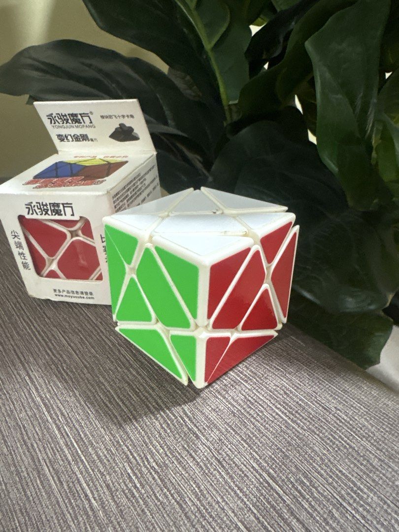 Cubi Rubik Magic Cube (Category: Board Games & Puzzles) located in Manila. Submitted by dig76 (Listing ID 1442372581, Image 2). Description: The puzzle features different colors stickers and is designed for fast twisting.It is labeled with Chinese characters indicating “speed performance” and “competition tool”.