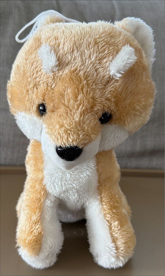 Cute Shiba Inu Plush Toy with Hanging String (Category: Plushies & Soft Toys) located in Antipolo. Submitted by lottientottie (Listing ID 1442413556, Image 1). Description: - Adorable Shiba Inu plush toy - Soft and fluffy material - Features a white hanging string - Approximately 9 inches tall - Ideal for collecting or as a gift - Ready for a new home!.
