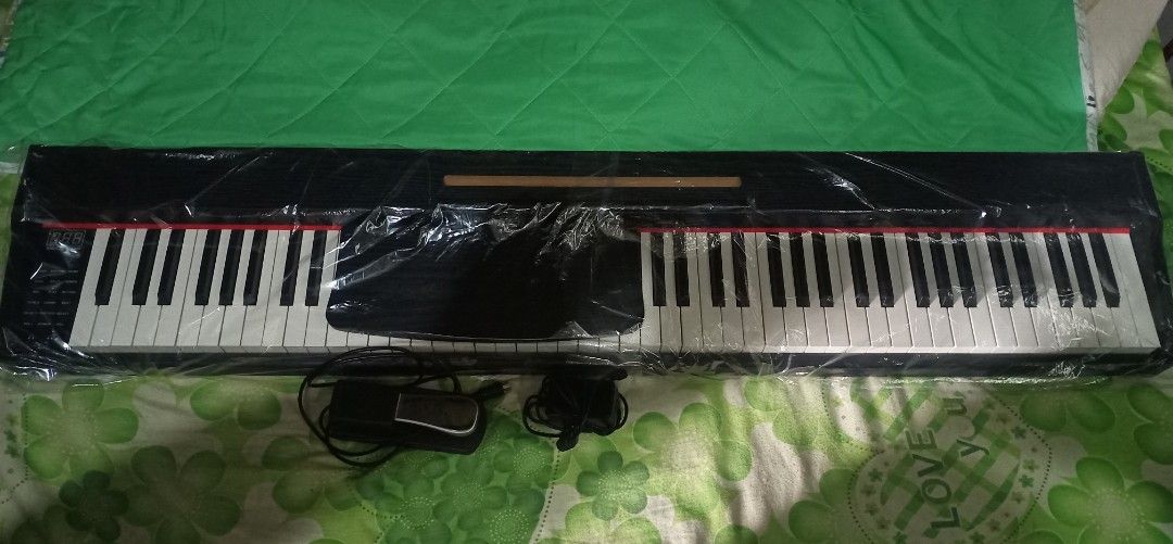 Digital Piano Keyboard with Stand and Pedal (Category: Musical Instruments) located in Santo Tomas. Submitted by jirobautista (Listing ID 1442445874, Image 1). Description: Need funds 😓 wala pong brand yung piano 88 Keys Piano Keyboard Smart Electric Piano Digital Piano Fully Weighted Piano Keyboard For Beginner made of wood po yung body nya naka tabi lang sa taas ng kama hindi nagagamit. binalot kolang sa plastic para hindi madumihan no issue a