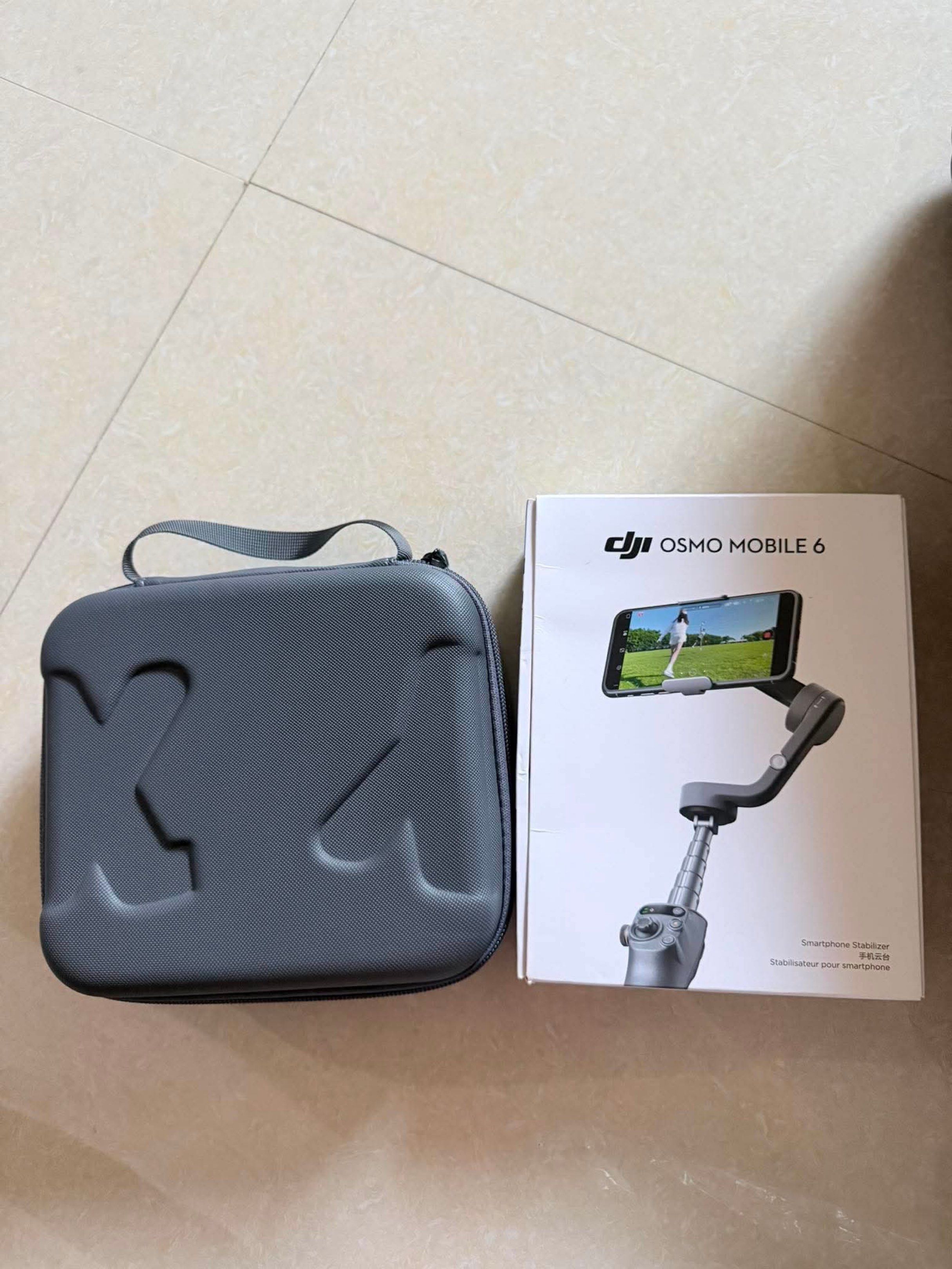 DJI Osmo Mobile 6 Smartphone Gimbal Stabilizer with Case (Category: Gimbals & Stabilizers ) located in Balanga. Submitted by strawberrypoptart (Listing ID 1442393681, Image 1). Description: - DJI Osmo Mobile 6 Gimbal - Perfect for vlogging and stable video - Includes: Gimbal, charging cable, grip tripod, magnetic phone clamp, storage pouch - Comes with a protective carrying case - Everything you need to start filming Get nyo na guys!! Almost bran