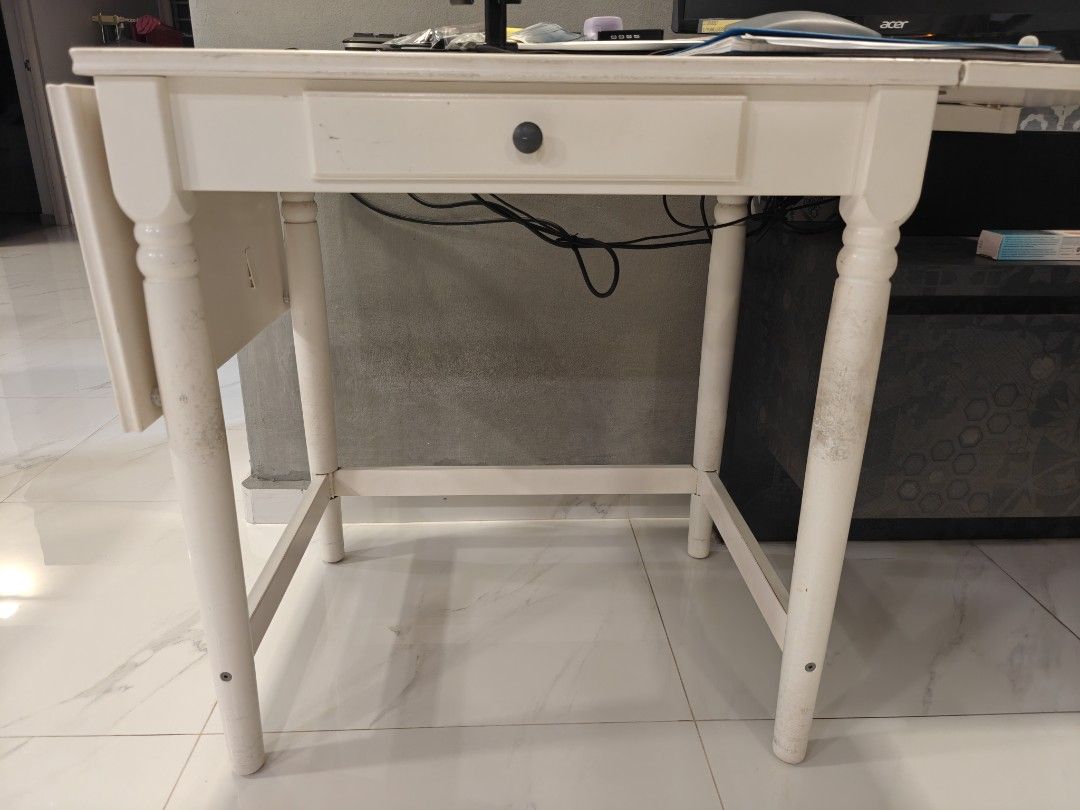 Extendable Study / working Table (Category: Tables & Sets) located in Singapore. Submitted by paperdoll1234 (Listing ID 1442471515, Image 1). Description: - extendable table - drawer is spoilt - Made of wood construction - wear and tear on the legs as per pic - Perfect for small spaces or as a functional side table - before extension 70cm. after extension 128cm. depth 50cm. height 74cm.