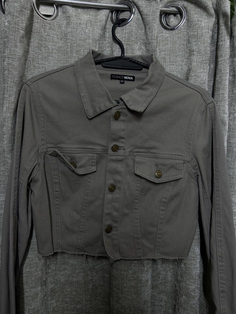 Fashion Nova Cropped Denim Jacket Grey (Category: Coats, Jackets and Outerwear) located in Manila. Submitted by yneraeiii (Listing ID 1442474026, Image 2). Description: - Grey cropped denim jacket from Fashion Nova - Features a raw hem detail - Button closure and two chest pockets - Long sleeves - Versatile piece, great with high-waisted bottoms.