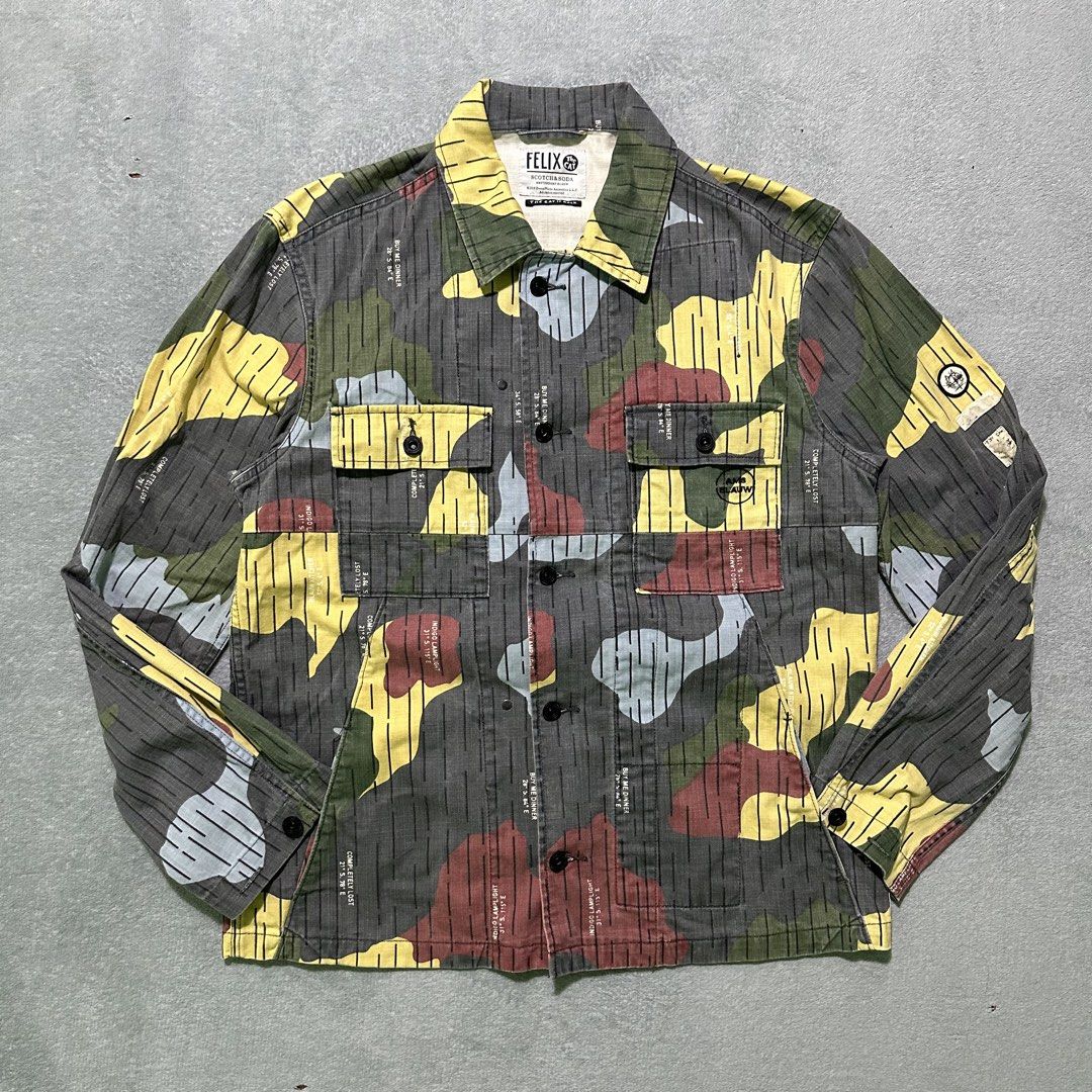 Felix the Cat x Scotch & Soda Camo Jacket size large (Category: Coats, Jackets and Outerwear) located in Villaverde. Submitted by bakatzy_secondhand_garments (Listing ID 1442498607, Image 1). Description: - Unique Felix the Cat and camouflage print - Two chest pockets - Button closure - Brand: Scotch & Soda - Size: L - Perfect statement piece.