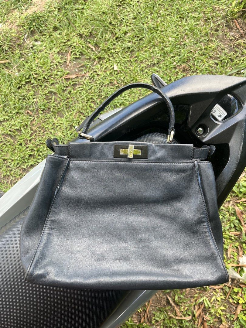 Fendi Peekaboo Black Leather Handbag (Category: Luxury Bags & Wallets) located in Tacloban City. Submitted by luxbag_phhh (Listing ID 1442389690, Image 1). Description: Classic Fendi Peekaboo bag in black leather with gold hardware. Features Fendi logo clasp and 'Made in Italy' tag. Perfect for any occasion. Check pics for details With sticker ntangal lang No sling .