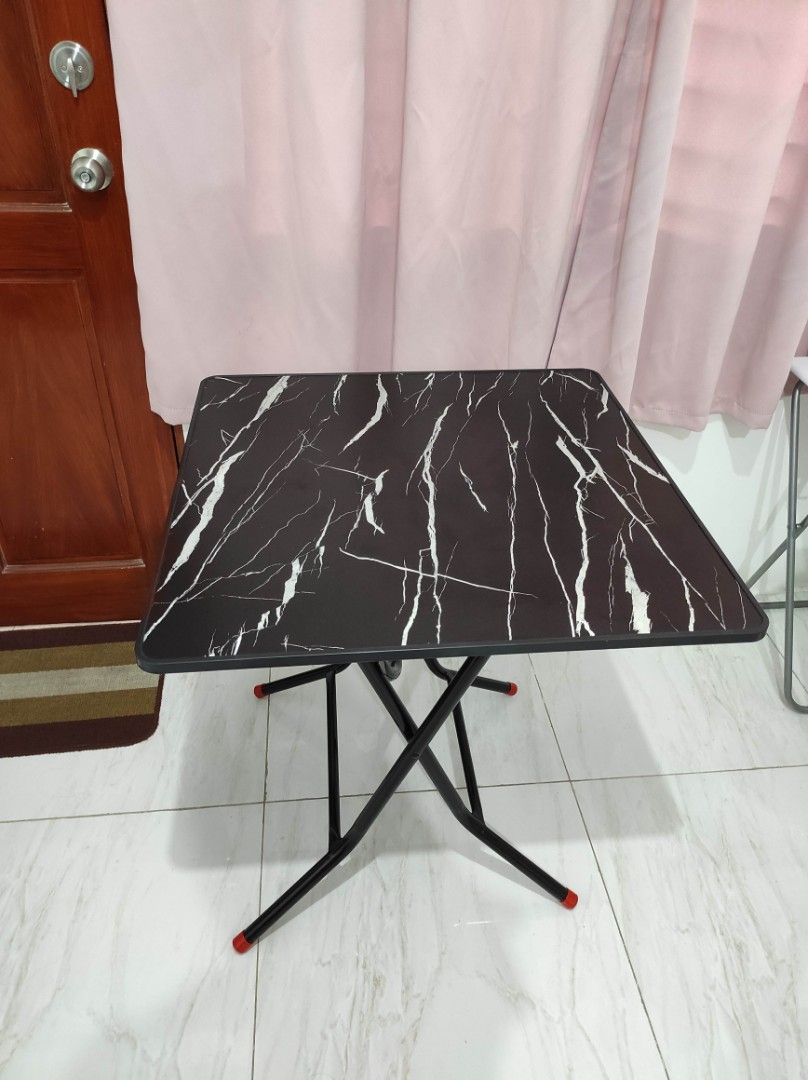 Foldable table (Category: Tables & Sets) located in Manila. Submitted by hzlblx (Listing ID 1442389591, Image 2). Description: Black (marble-ish) foldable table. Preferred for pick up/delivery. .