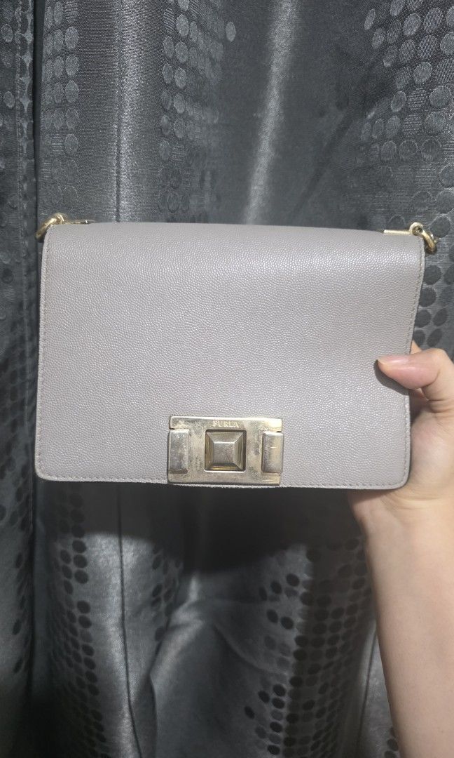Furla gray bag (Category: Luxury Bags & Wallets) located in Manila. Submitted by declutterforbtsticket (Listing ID 1442424347, Image 1). Description: stain in interior.