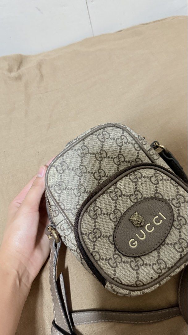 Gucci Neo Vintage GG Supreme Mini (Category: Luxury Bags & Wallets) located in San Pablo. Submitted by dees_collection (Listing ID 1442522949, Image 2). Description: Material: Crafted from the brand’s iconic beige and ebony GG Supreme coated canvas with brown leather trims. Hardware & Details: Features a distinctive oval leather patch with a metal feline head and the Gucci logo emblazoned across the front. Accents: Designed with an adjustable bro