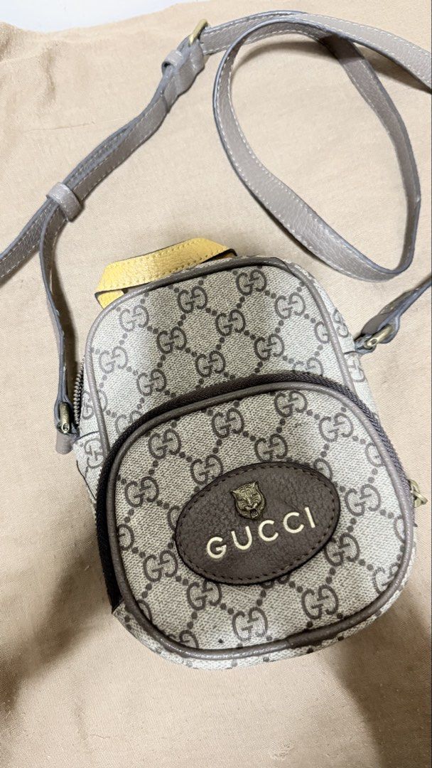 Gucci Neo Vintage GG Supreme Mini (Category: Luxury Bags & Wallets) located in San Pablo. Submitted by dees_collection (Listing ID 1442522949, Image 1). Description: Material: Crafted from the brand’s iconic beige and ebony GG Supreme coated canvas with brown leather trims. Hardware & Details: Features a distinctive oval leather patch with a metal feline head and the Gucci logo emblazoned across the front. Accents: Designed with an adjustable bro